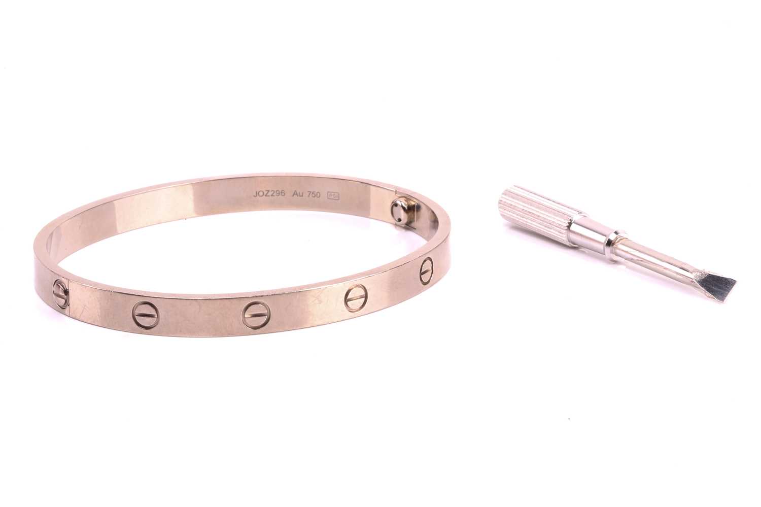 Cartier - a 'LOVE' bangle in 18ct white gold, composed of two rigid arcs with screw motifs, - Image 2 of 17