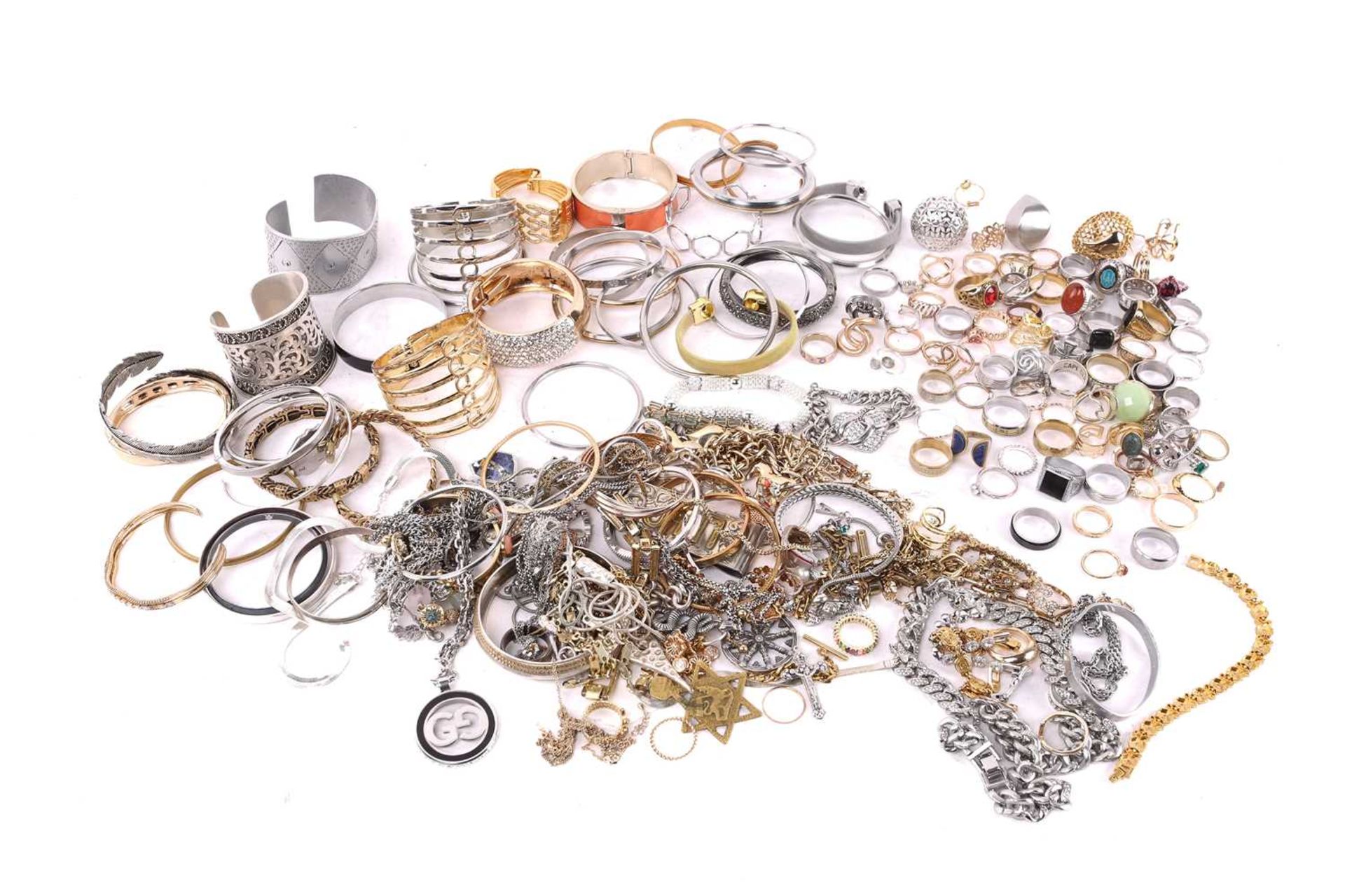 A quantity of costume jewellery including cuff bangles, necklaces and rings. Total weight 2,718