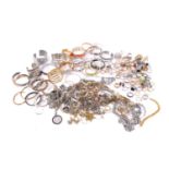 A quantity of costume jewellery including cuff bangles, necklaces and rings. Total weight 2,718