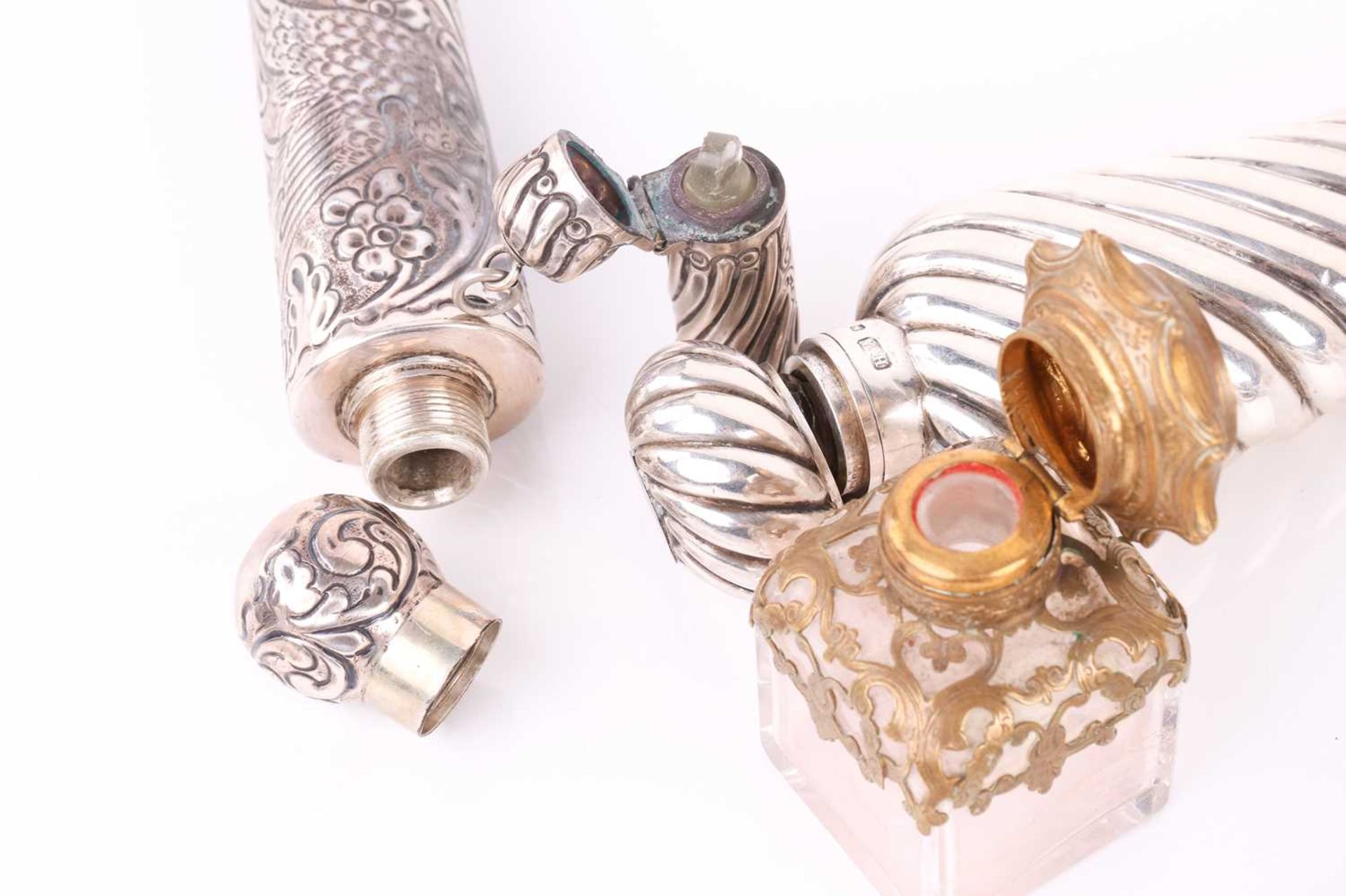 A collection of silver scent bottles, including a large conical with spiral reeded decoration and - Image 3 of 16