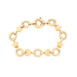 A fancy link bracelet, the oval links interspersed with stars and hearts, to a spring clasp, the