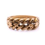 A dress ring in 18ct yellow gold, of twisted rope design, with applied stars and hearts motifs, to