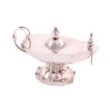 A Georg Jensen oil lamp, design no.12, the lamp with blossom finial, scroll and beaded handle,