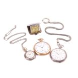 Three open-face pocket watches and a travel clock. The first open-face pocket watch is a Reliance by