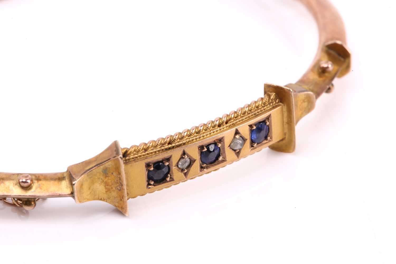 A Victorian hinged bracelet set with blue paste and diamond, the bangle centred with a curved - Image 4 of 7