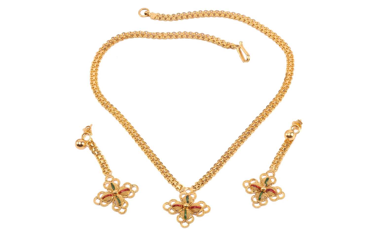 An Indian enamelled quatrefoil necklace and a matching pair of earrings; the necklace comprises a