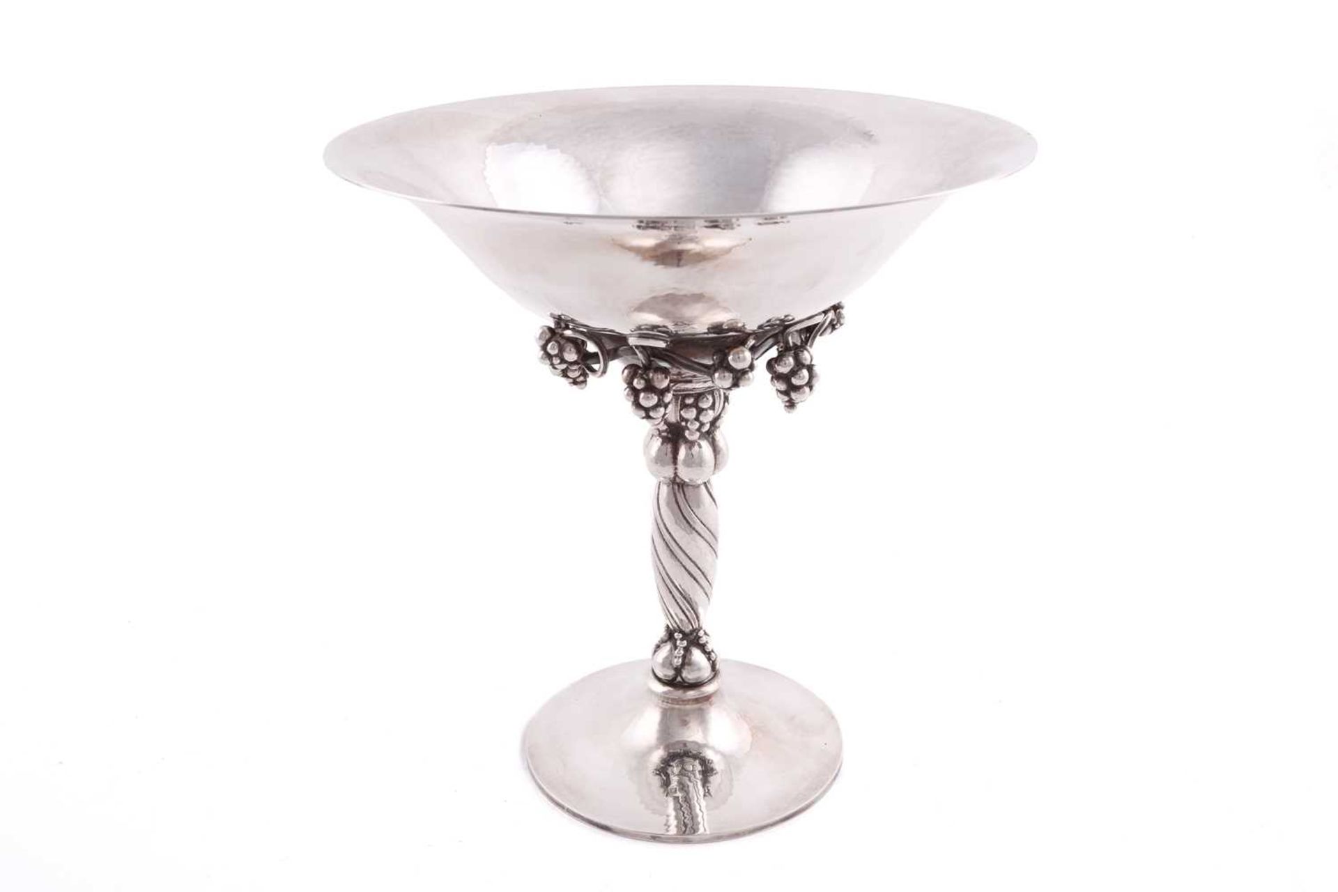 Georg Jensen - a tazza designed with spot-hammered circular flared bowl standing atop twisted