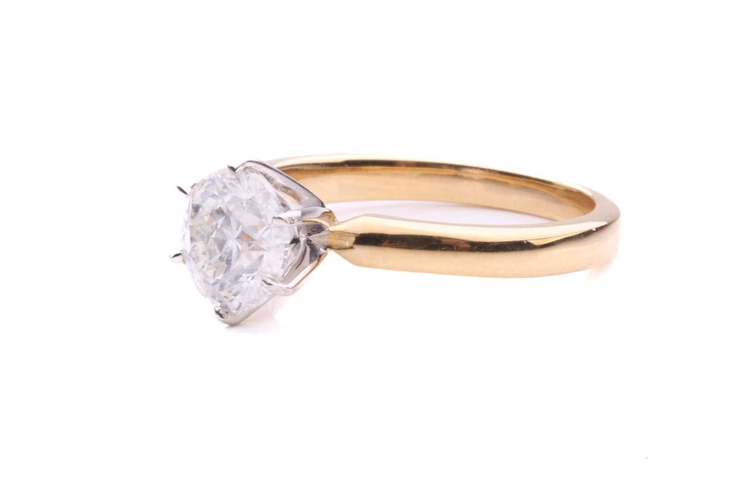 A diamond solitaire ring in 18ct gold, centred with a brilliant-cut diamond of 6.7 mm with an - Image 2 of 5