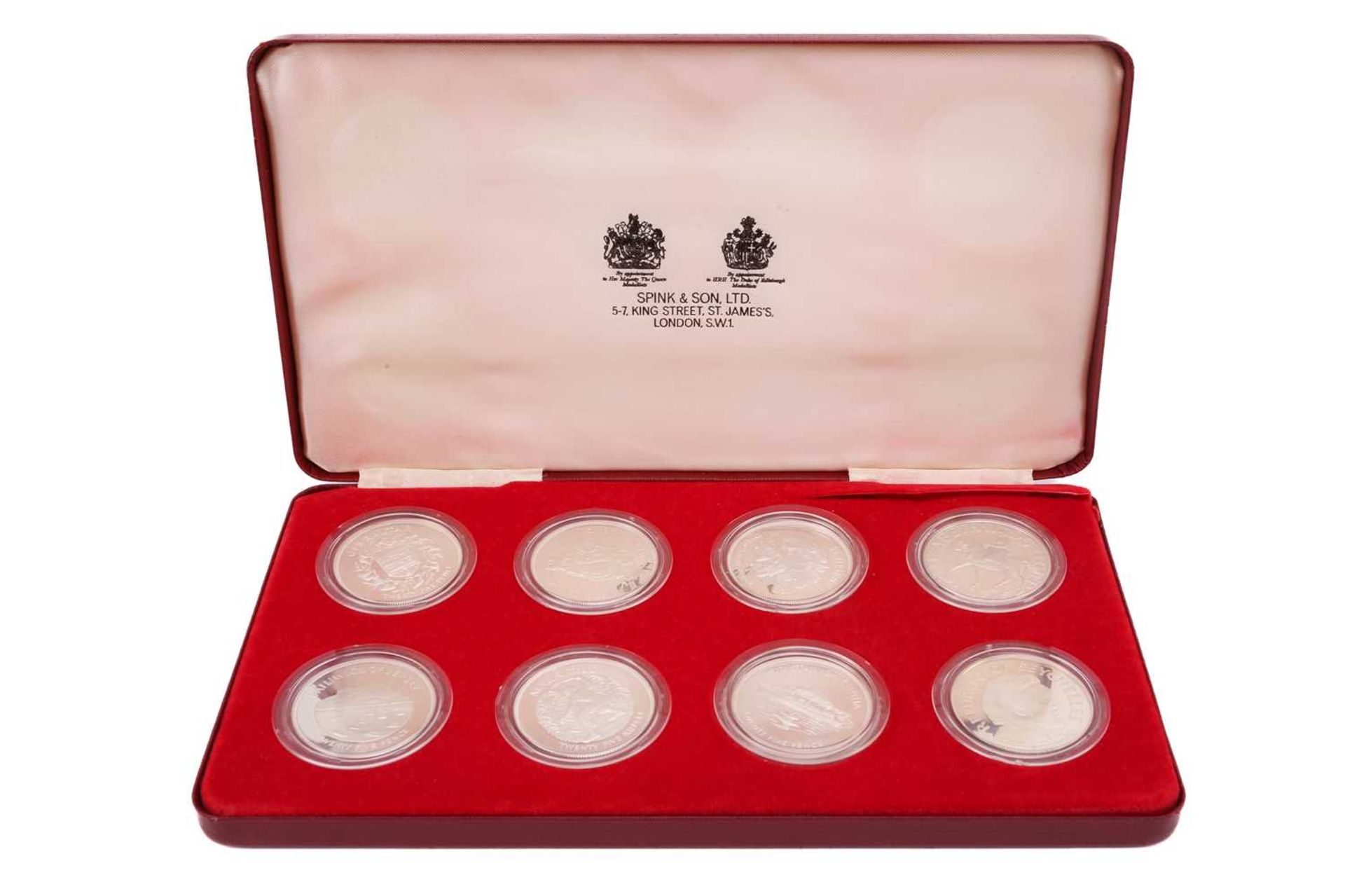 A cased set of eight proof silver encapsulated crown pieces, to commemorate Queen Elizabeth II