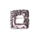 Georg Jensen - a square openwork brooch in silver, featuring a resting deer and squirrel in foliage,