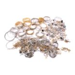 A quantity of jewellery including bangles, bracelets, necklaces and rings. Total weight 2,086