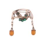 Georg Jensen - an Art Nouveau amber drop brooch set with chrysoprase, the arched frame with a floral