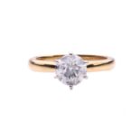 A diamond solitaire ring in 18ct gold, centred with a brilliant-cut diamond of 6.7 mm with an