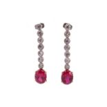 A pair of old-cut diamond and synthetic ruby pendant earrings, each features an oval-cut bright