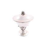 Georg Jensen - a covered compote, a polished bowl with flared rim, supported with berry and leaves