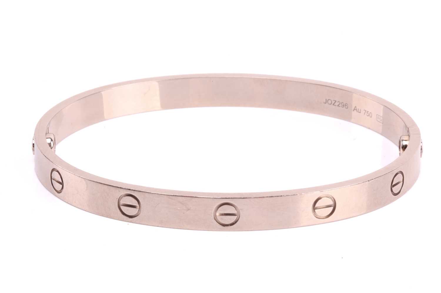 Cartier - a 'LOVE' bangle in 18ct white gold, composed of two rigid arcs with screw motifs, - Image 3 of 17