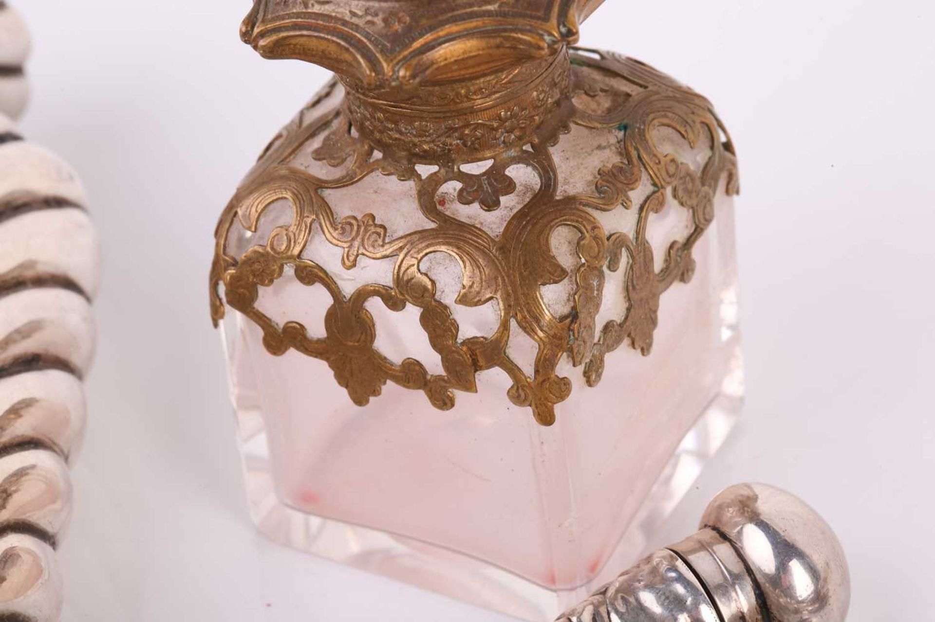 A collection of silver scent bottles, including a large conical with spiral reeded decoration and - Image 11 of 16