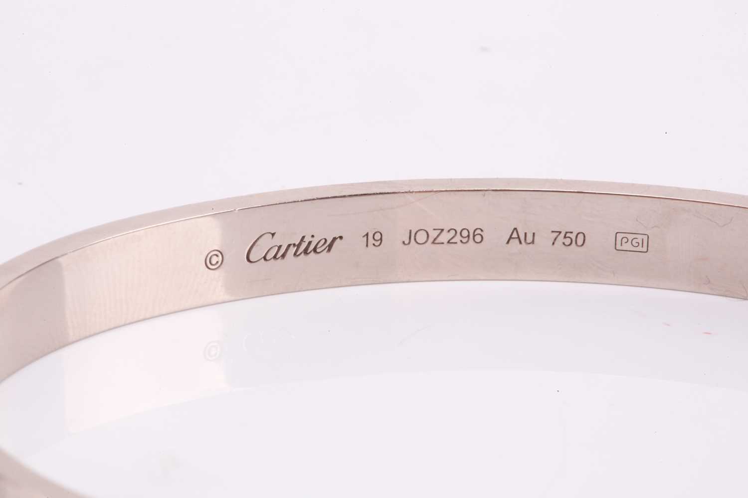 Cartier - a 'LOVE' bangle in 18ct white gold, composed of two rigid arcs with screw motifs, - Image 9 of 17