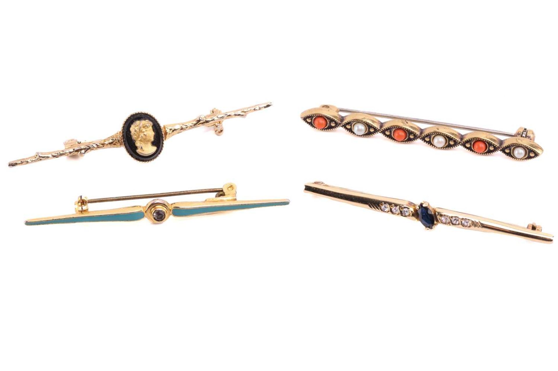 Four gem-set bar brooches, including a coral and seed pearl bar brooch, a sapphire and CZ bar brooch
