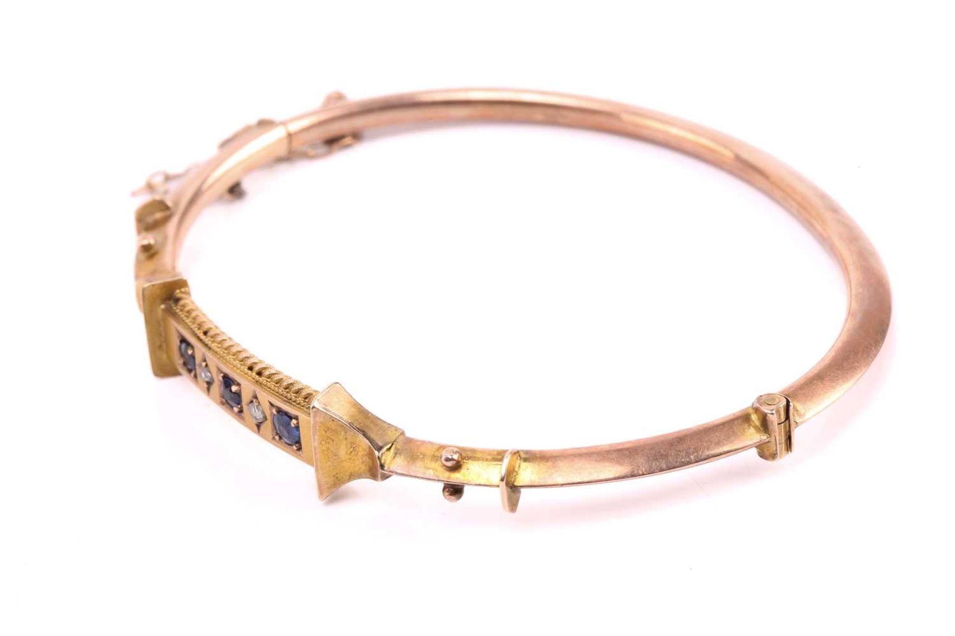 A Victorian hinged bracelet set with blue paste and diamond, the bangle centred with a curved - Image 6 of 7