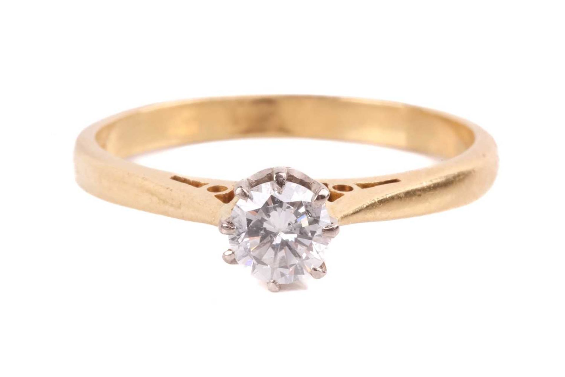 A diamond solitaire ring set with a round brilliant cut diamond with an estimated weight of 0.35ct