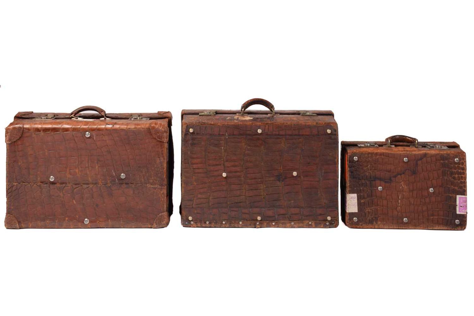 A near pair of crocodile skin type leather suitcases, early 20th century, one with fitted - Image 2 of 8