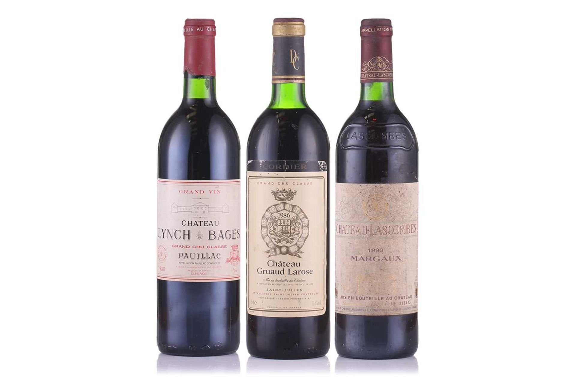 A bottle of 1986 Chateau Gruaud Larose, together with a 1990 Chateau Lascombes and a 1988 Margaux,