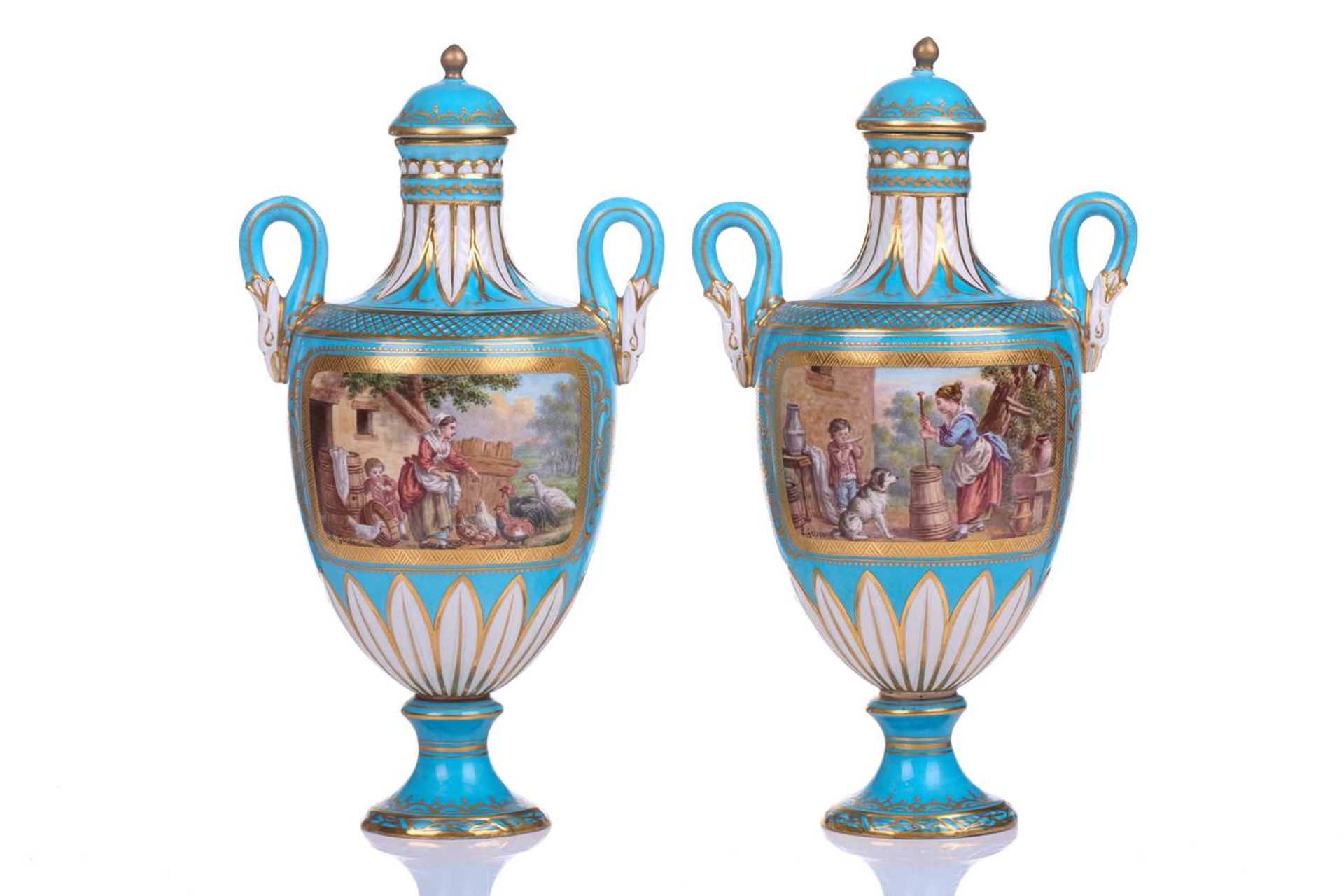 A pair of small Sevres Bleu Celeste two-handled vases and covers,19th century, each painted with