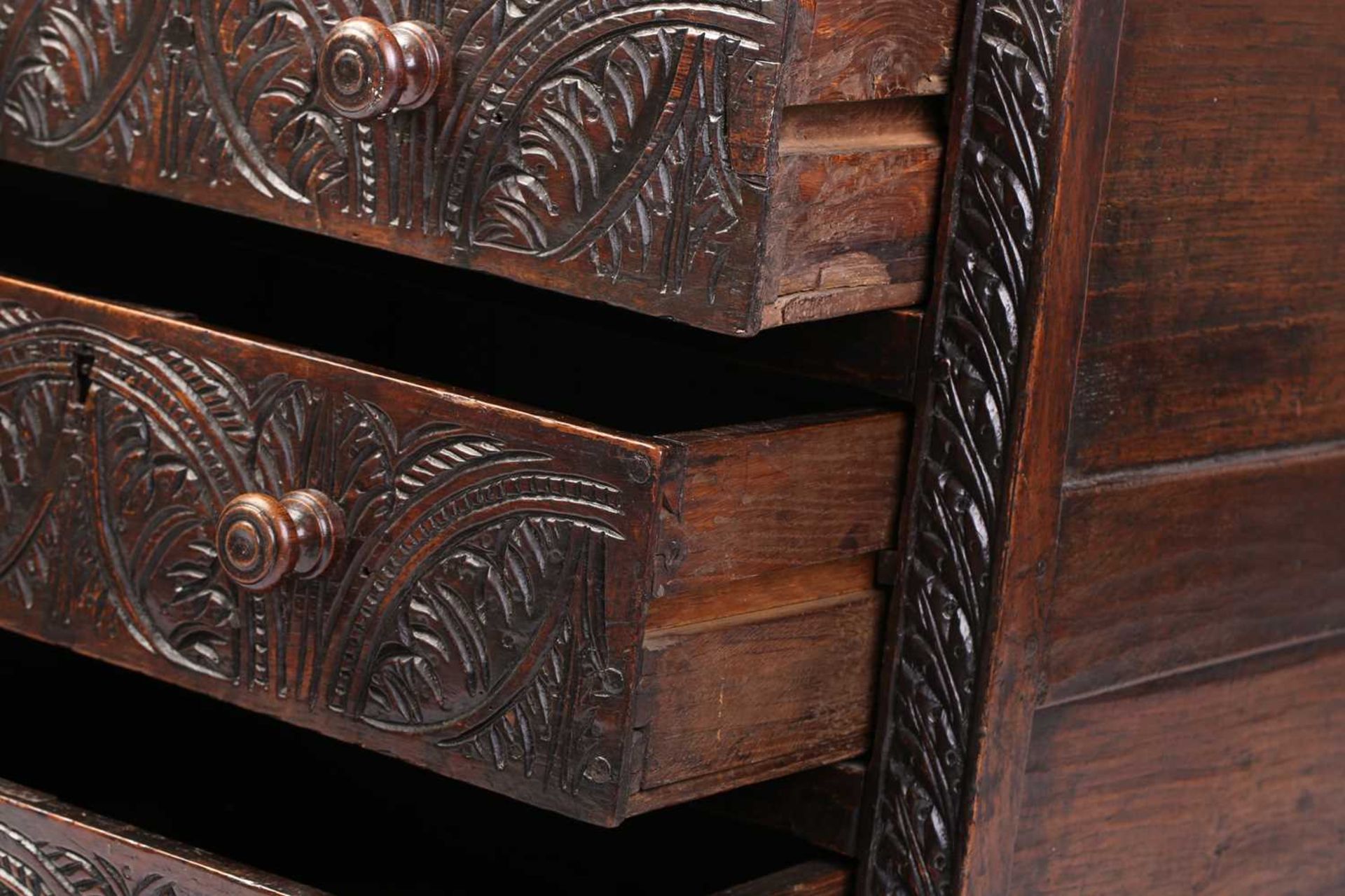 A carved oak 17th-century style three-drawer chest (17th century period timber and later, re- - Image 6 of 9