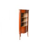 An Edwardian figured satinwood corner vitrine with single serpentine glazed door, with satinwood and