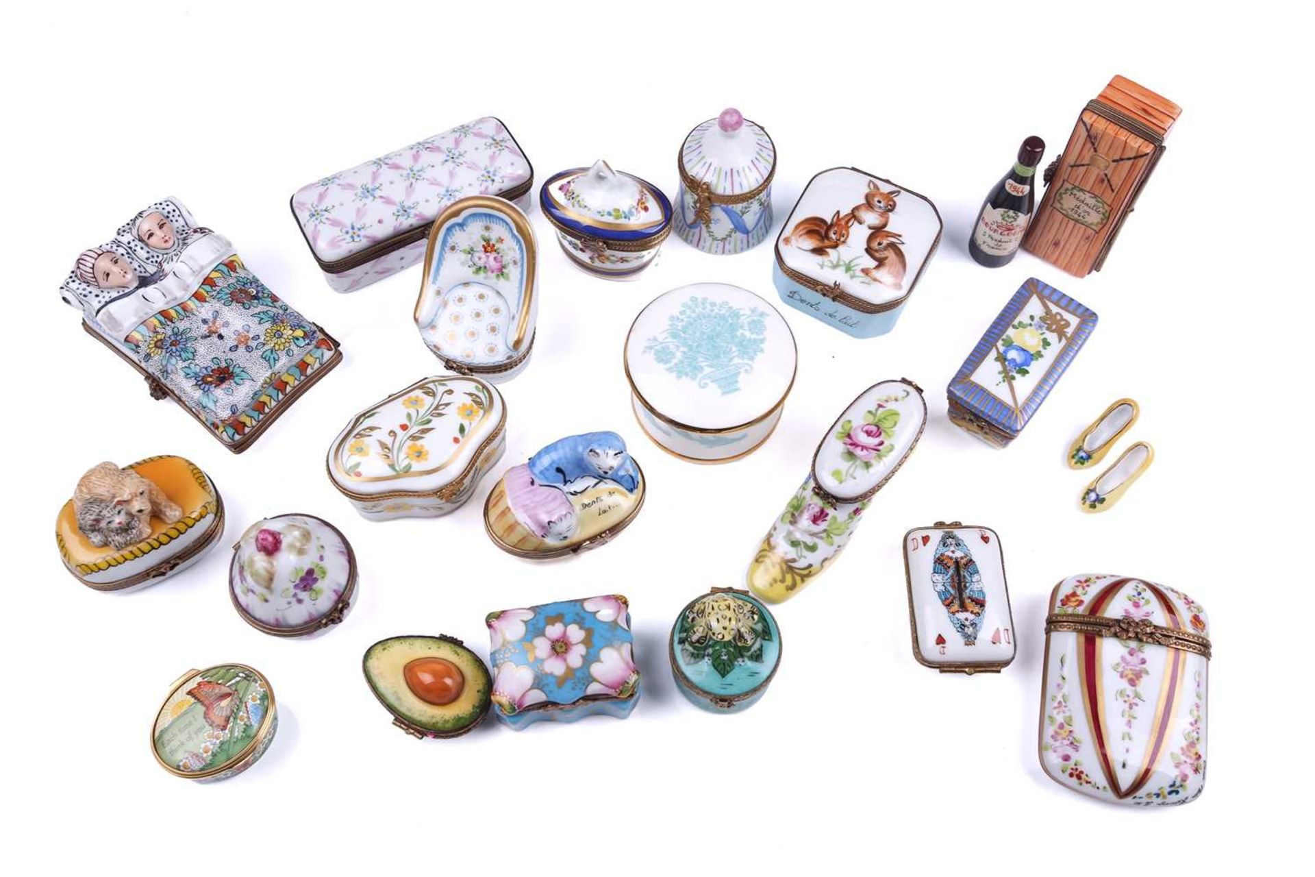 A small collection of Limoges porcelain novelty trinket and pill boxes including boot form box