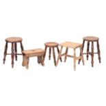 A collection of turned ash and elm stools and also a boarded stool. (5)