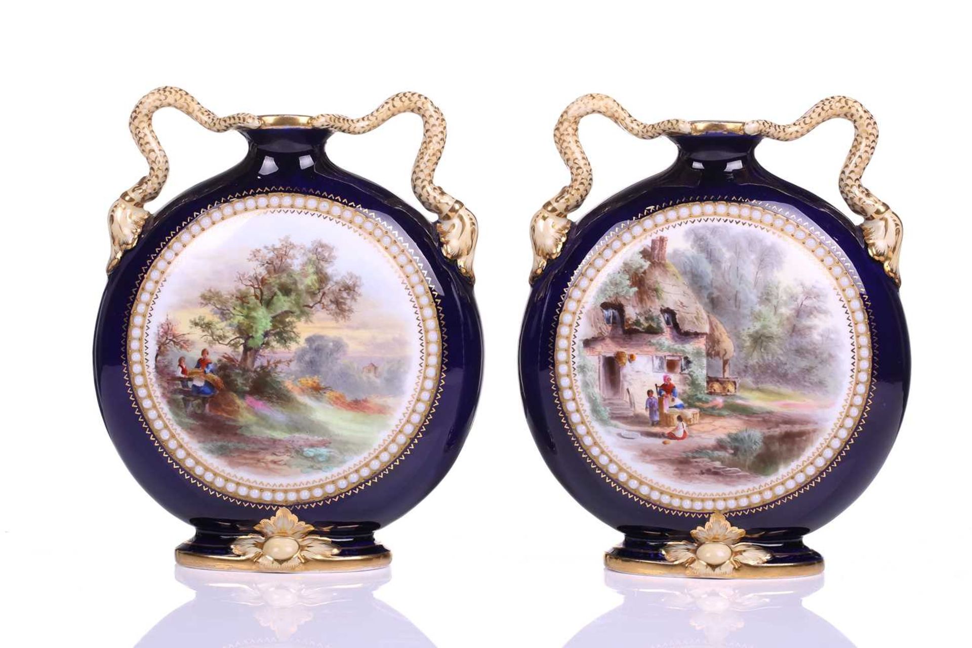 A pair of Grainger and Co Worcester Bleu de Roi pilgrim flask vases, shape number 1015, painted with