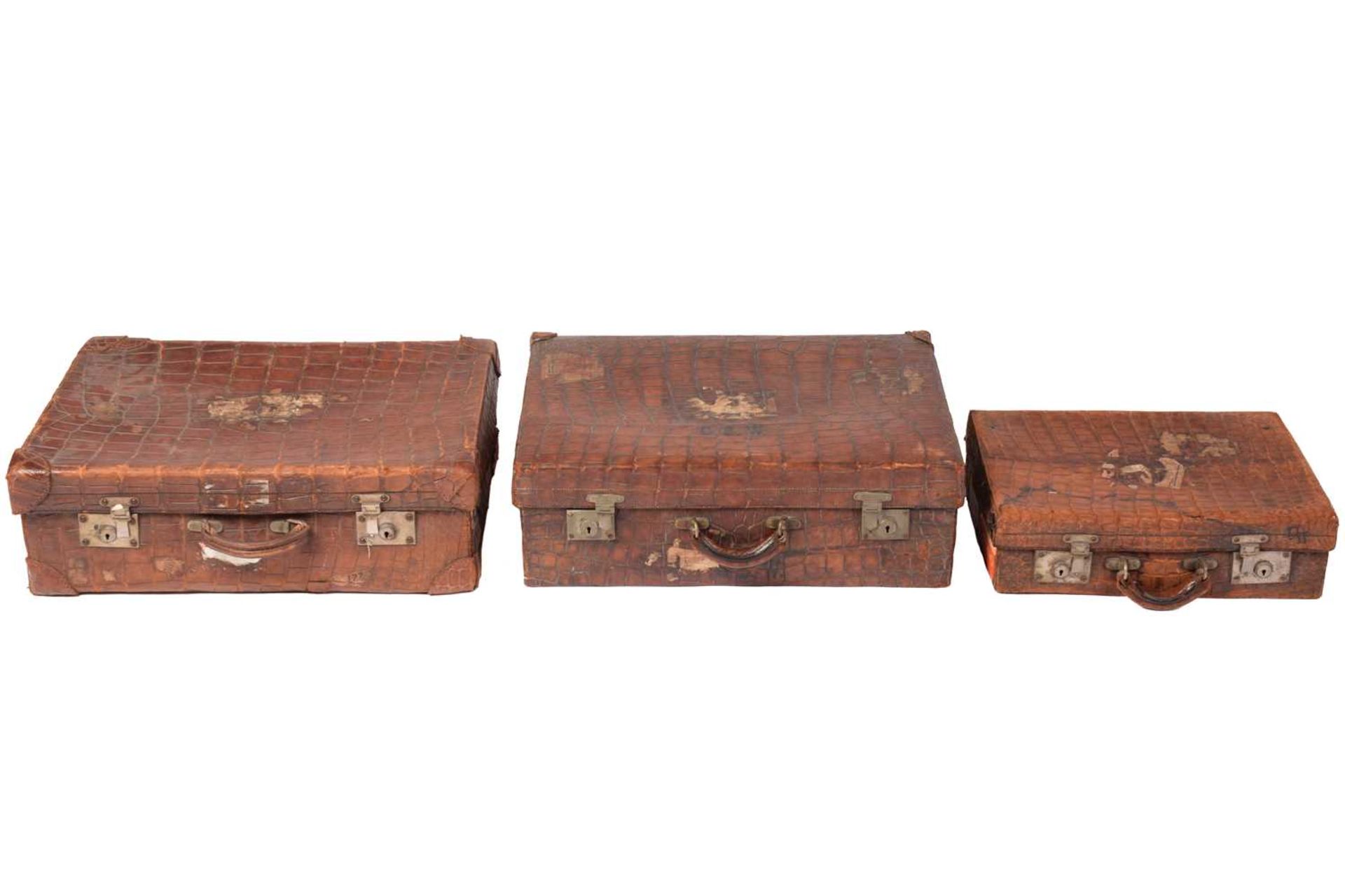 A near pair of crocodile skin type leather suitcases, early 20th century, one with fitted - Image 8 of 8