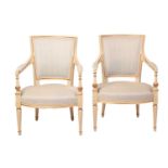 A pair of French fauteuils, 20th century, with upholstered arm rests, back and seat, the sprung seat