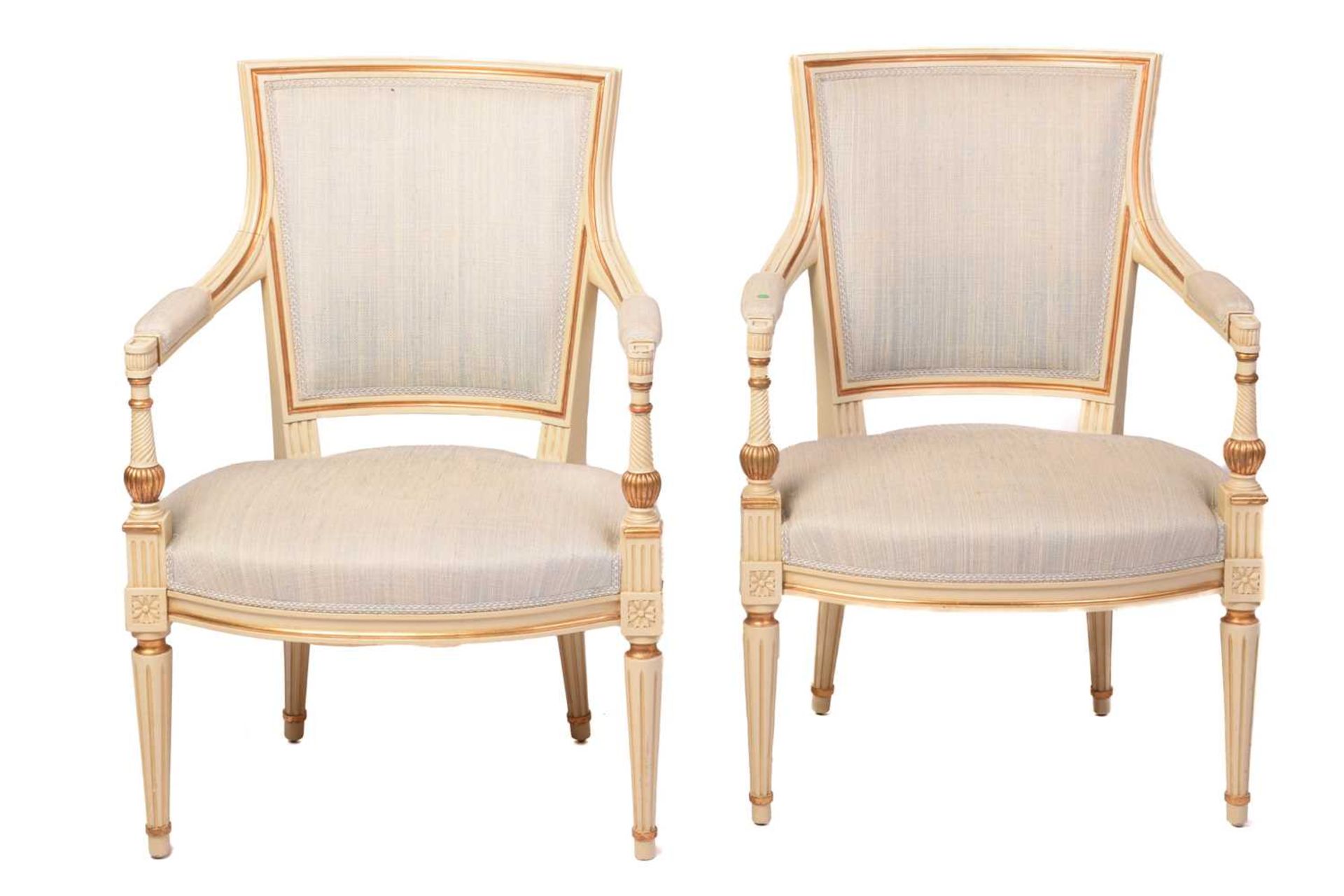 A pair of French fauteuils, 20th century, with upholstered arm rests, back and seat, the sprung seat