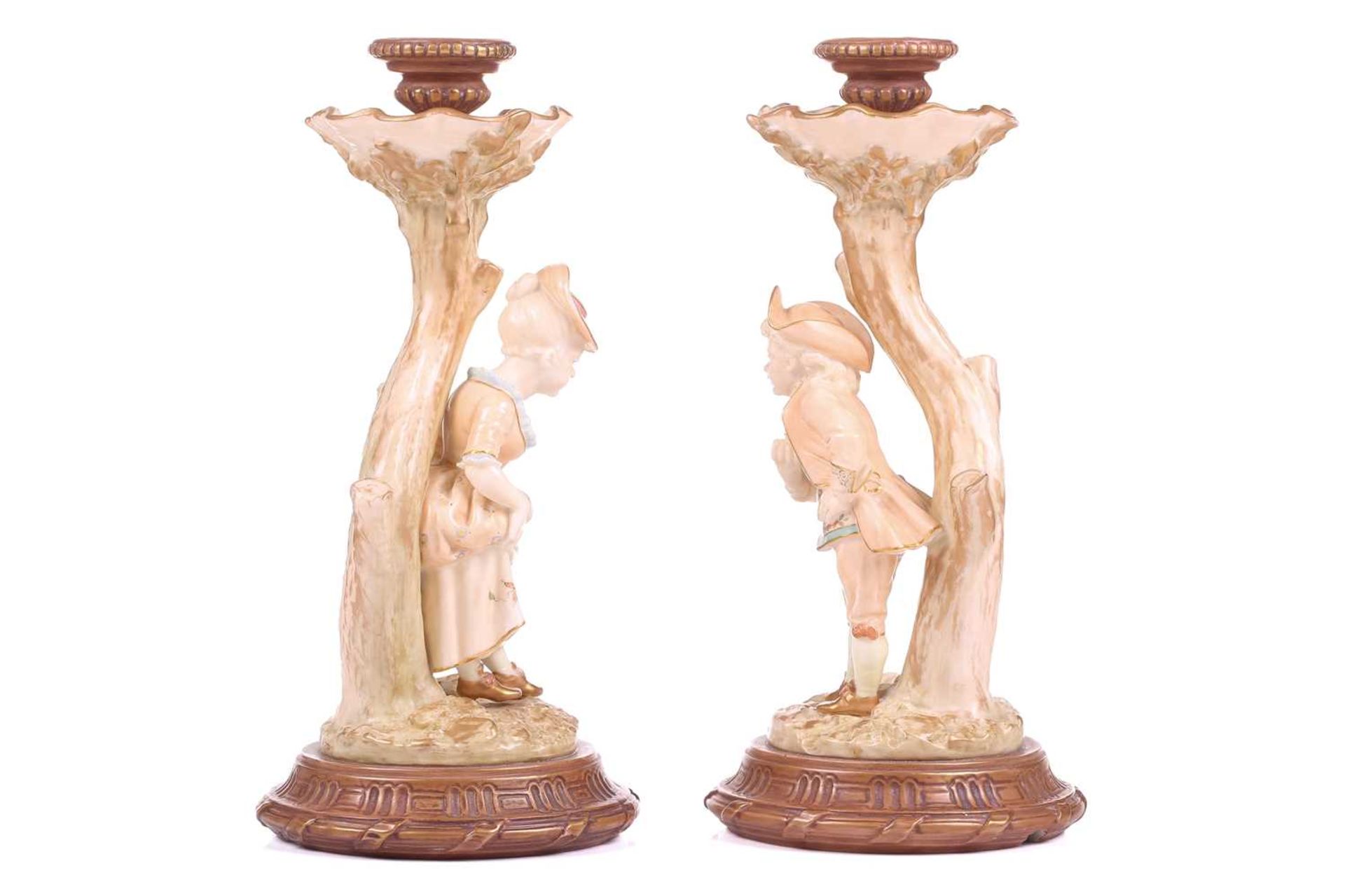 A pair of Royal Worcester figural candlesticks, modelled by James Hadley, as a boy and girl in - Bild 2 aus 8