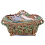 A Minton Majolica pattern 668 game pie dish, liner and cover bearing the date cypher for 1868, the
