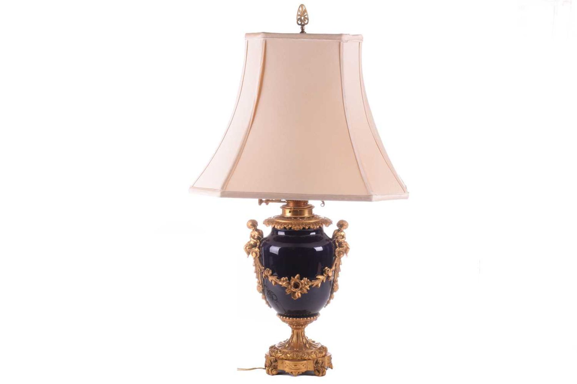 A large French ormolu and cobalt-blue ceramic table lamp, originally converted from an oil lamp,