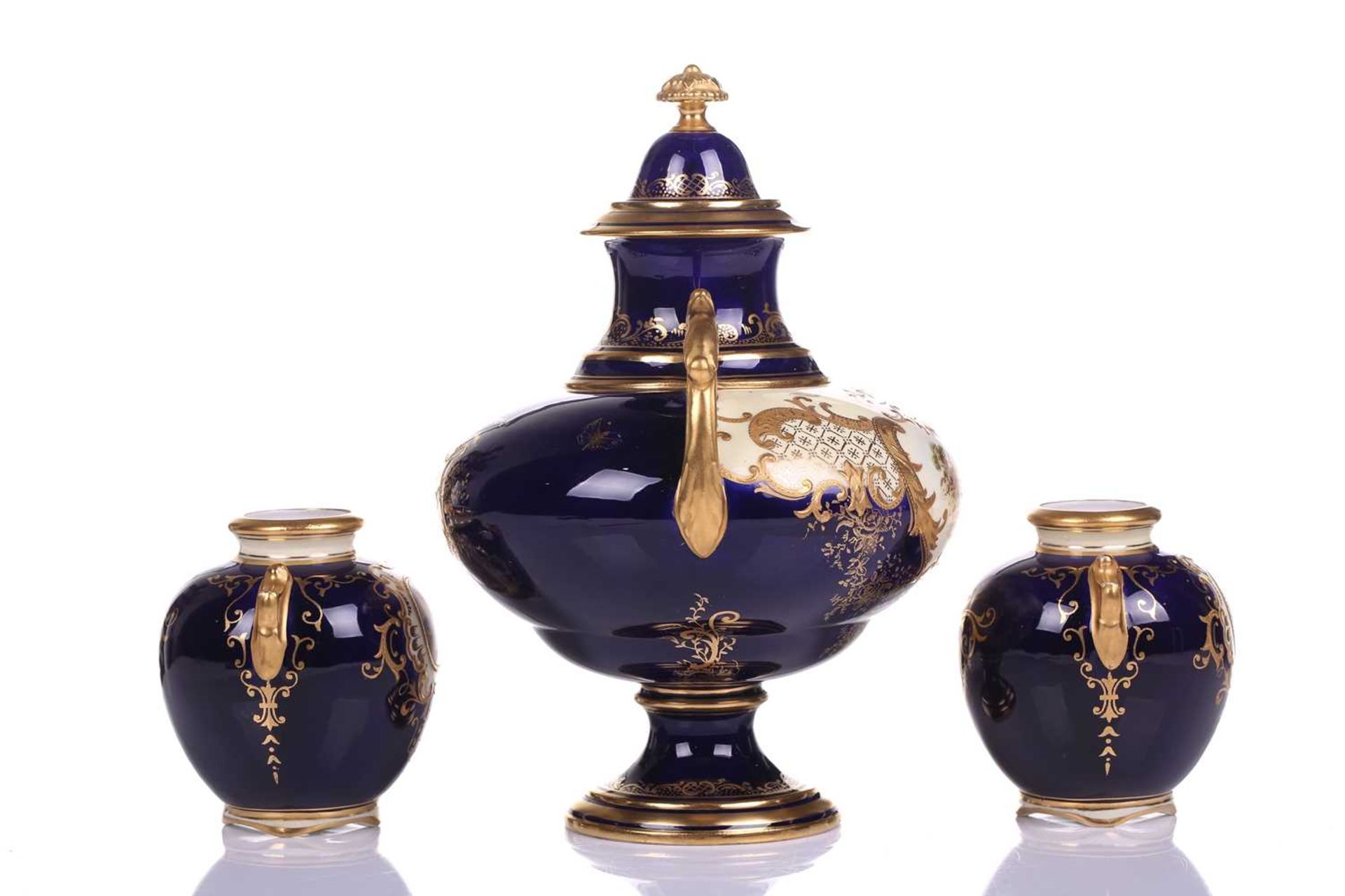 A Coalport Bleu de Roi porcelain two-handled globular urn and cover hand painted with romantic - Image 2 of 12