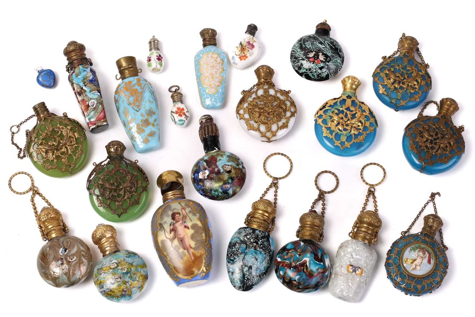 A good collection of miniature Continental ceramic and Murano glass scent bottles, many with gilt