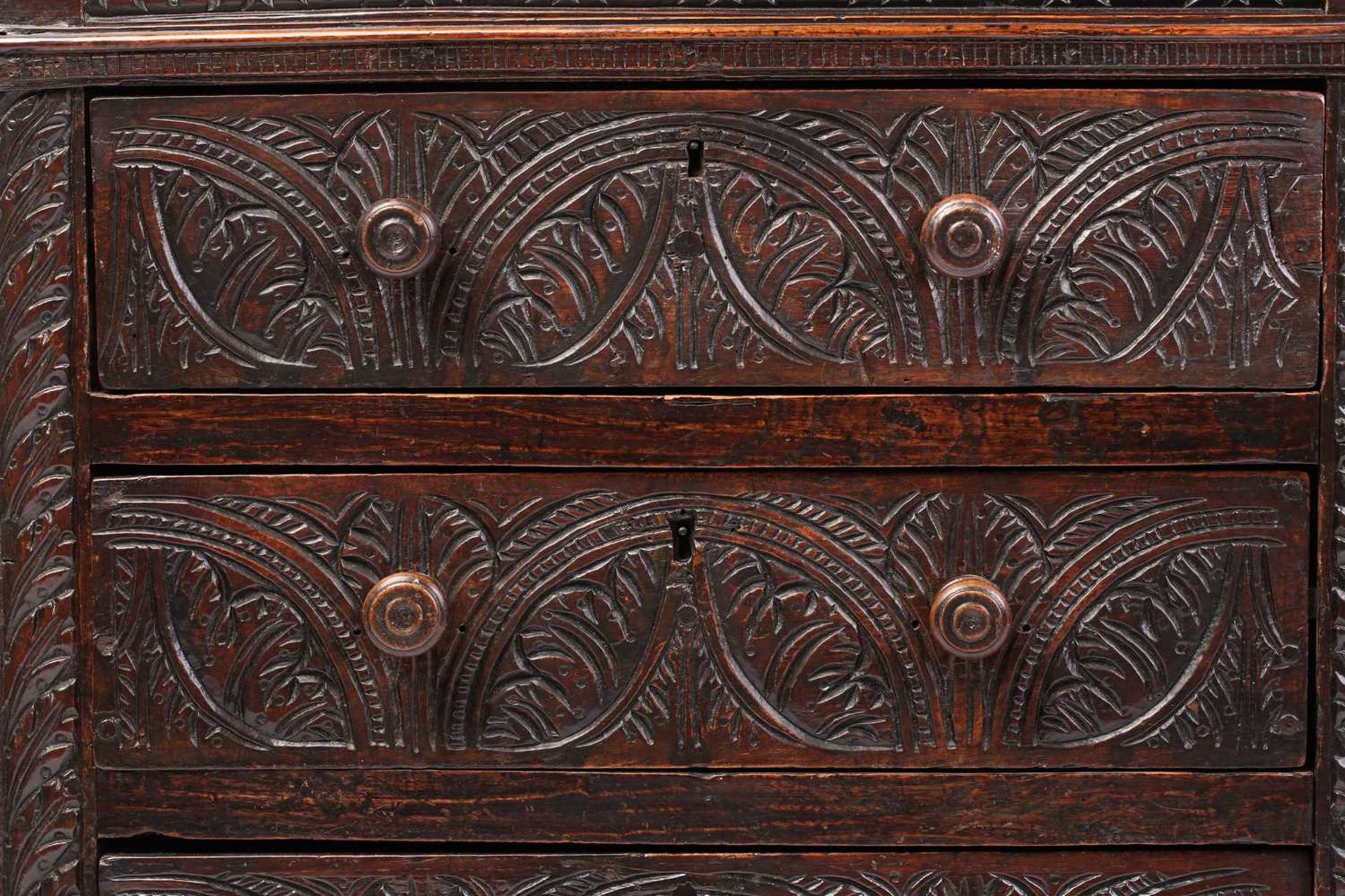 A carved oak 17th-century style three-drawer chest (17th century period timber and later, re- - Image 2 of 9