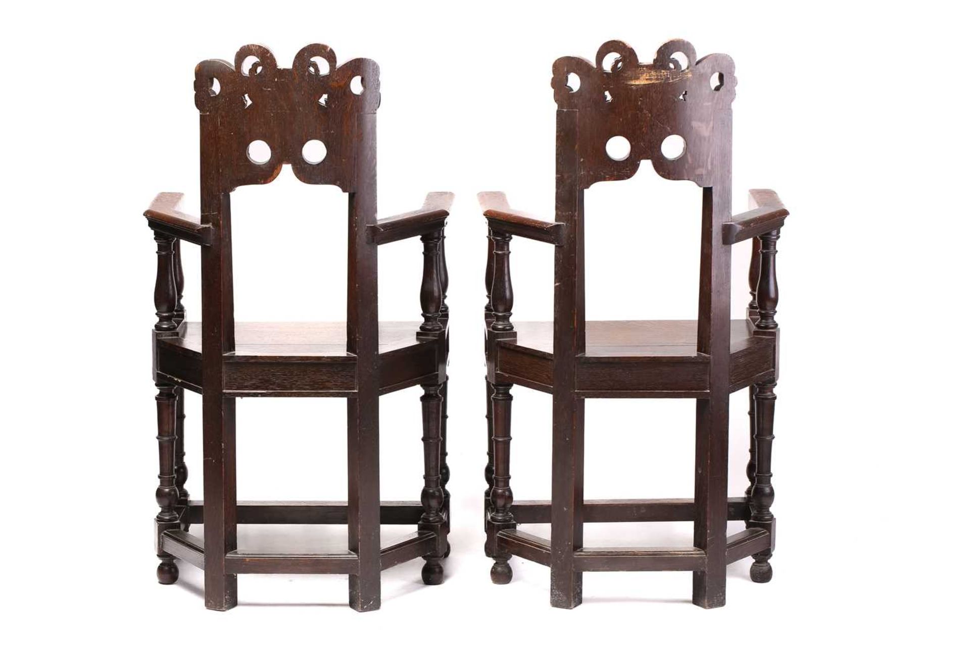 A pair of French carved oak caquetoire armchairs, 19th/20th century, the curved backs carved and - Image 7 of 11