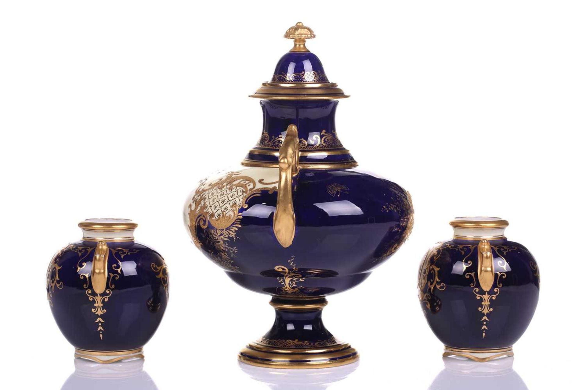 A Coalport Bleu de Roi porcelain two-handled globular urn and cover hand painted with romantic - Image 3 of 12