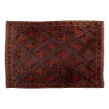 A large brick red/brown ground Qashqai rug with blue St. Andrew's cross filled diamond pattern