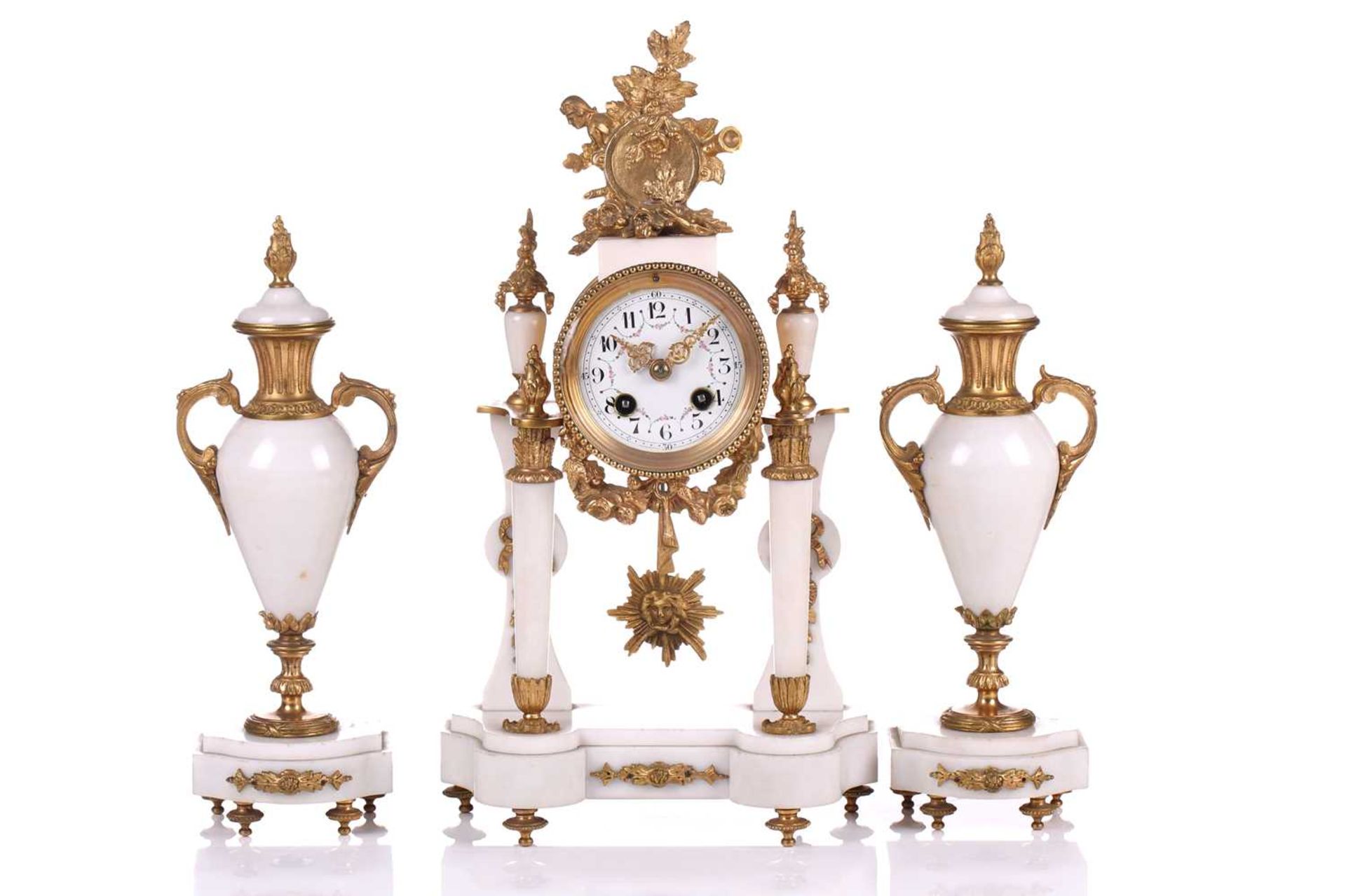 A Louis XVI-style white marble and ormolu 8-day clock garniture, early 20th century, fitted with a