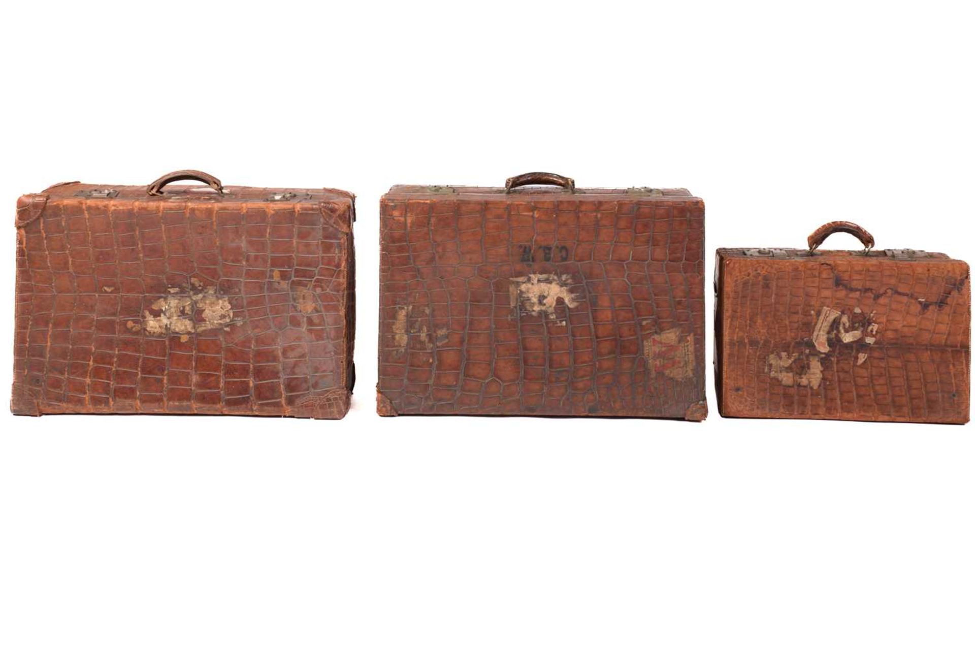 A near pair of crocodile skin type leather suitcases, early 20th century, one with fitted - Image 7 of 8