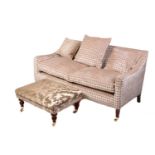 A Regency style settee, 20th century, well upholstered in a square grid pattern material, on