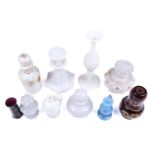 A small collection of Victorian Vaseline glass perfume bottles and stoppers including an octagonal