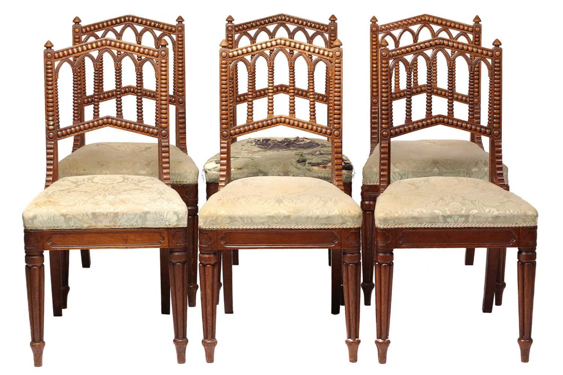 A matched set of six William IV oak Gothic revival side chairs possibly by Gillows of Lancaster